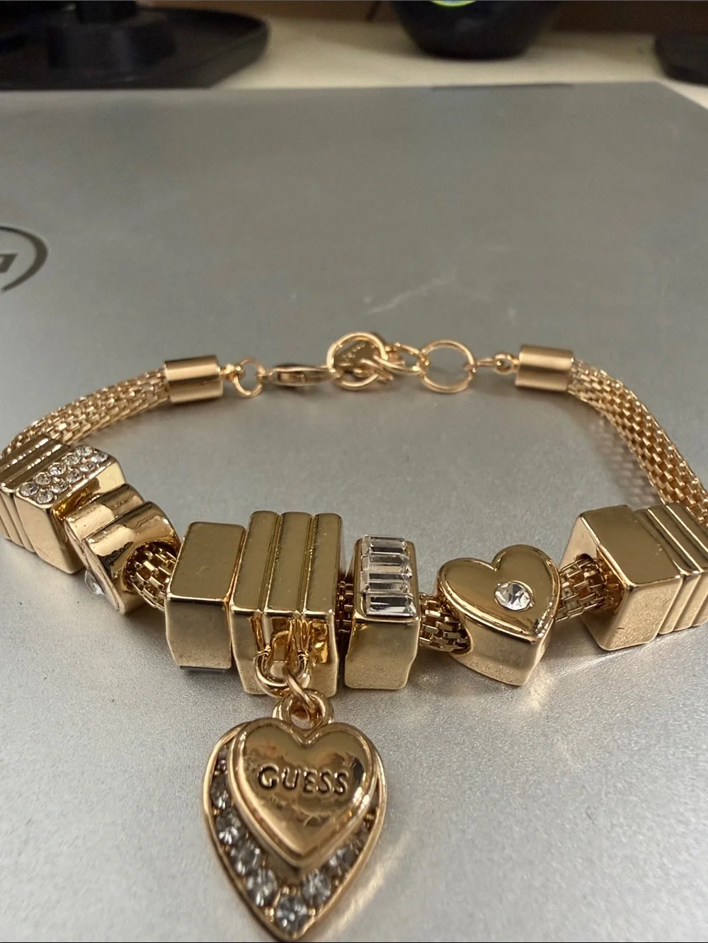 Gold color Guess mesh. Charm bracelet 8”.   NWOT.  Beautiful